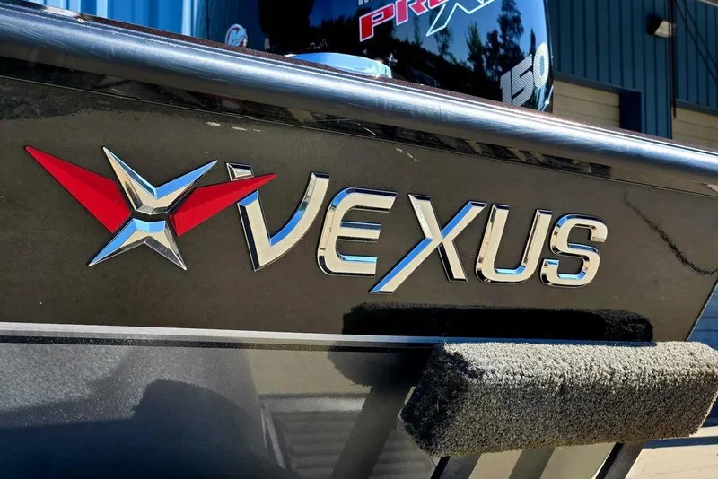 Slide: The Image of 2022 Vexus AVX1980 boat logo with metallic finish and red-blue emblem. - 8