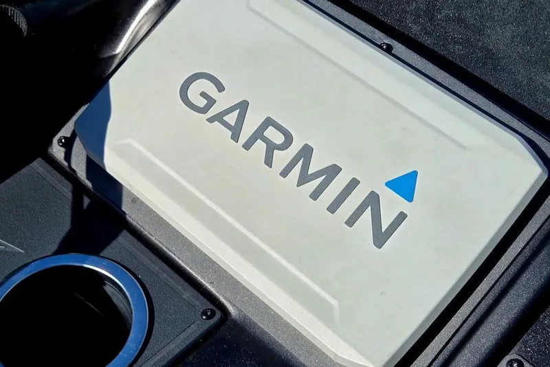 Slide: The Image of Garmin device on 2022 Vexus AVX1980 boat dashboard, featuring sleek design and cup holder. - 14