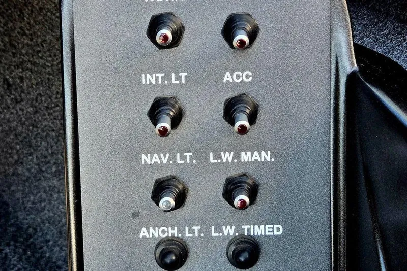 Slide: The Image of Control panel of a 2022 Vexus AVX1980 boat with labeled switches. - 40