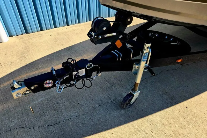 Slide: The Image of Trailer hitch of a 2022 Vexus AVX1980 boat on concrete surface. - 10