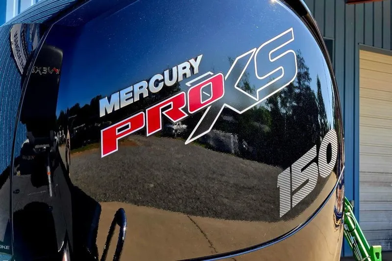 Slide: The Image of Mercury Pro XS 150 engine on 2022 Vexus AVX1980 boat, reflecting outdoor scenery. - 7
