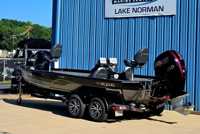 Slide: The Image of 2022 Vexus AVX1980 boat at Lake Norman Marine Center, featuring sleek design and powerful engine. - 4