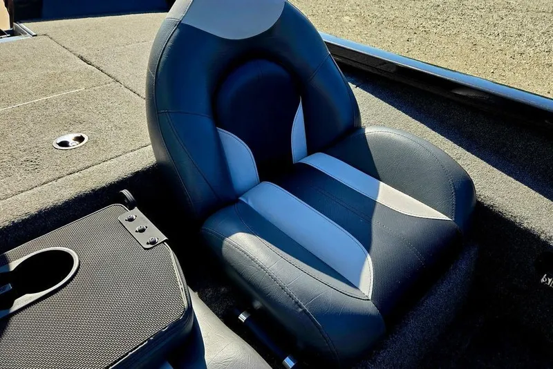 Slide: The Image of 2022 Vexus AVX1980 boat seat with black and white upholstery, featuring a cup holder. - 28