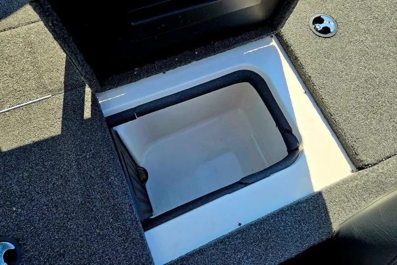 Slide: The Image of Storage compartment in 2022 Vexus AVX1980 boat, featuring carpeted interior and secure latch. - 43