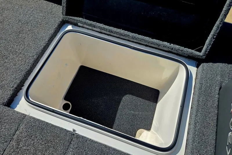 Slide: The Image of Open storage compartment in 2022 Vexus AVX1980 boat, featuring carpeted interior. - 49