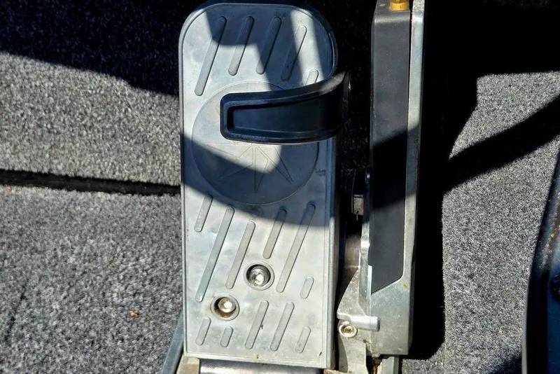 Slide: The Image of Foot pedal mechanism on a 2022 Vexus AVX1980 boat, featuring textured metal surface. - 39