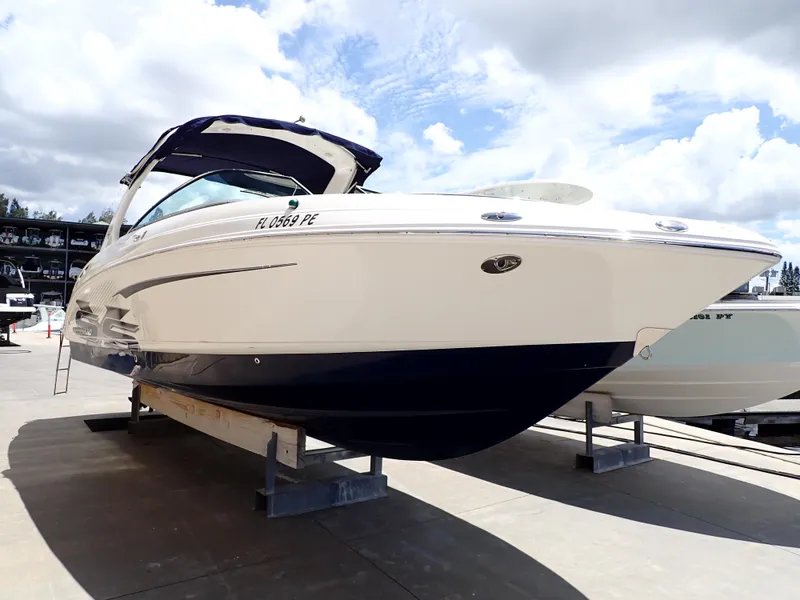 The Image of 2011 Chaparral 287 SSX boat on display under a cloudy sky. - 0