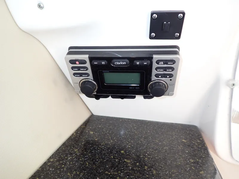 Slide: The Image of Clarion stereo system on 2011 Chaparral 287 SSX boat dashboard. - 46