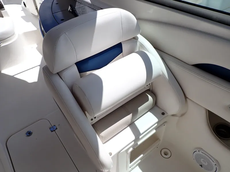 Slide: The Image of 2011 Chaparral 287 SSX boat interior with white and blue seating. - 41