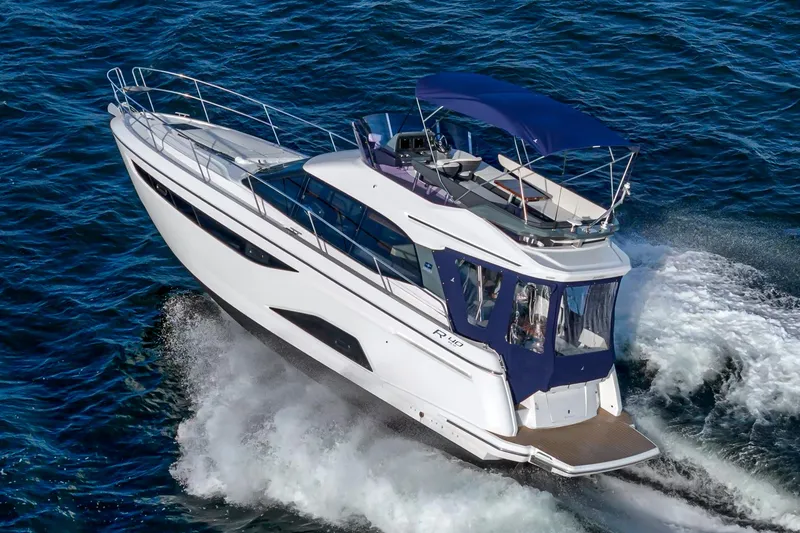 Slide: The Image of 2024 Bavaria R40 yacht cruising on open water, featuring sleek design and modern amenities. - 14