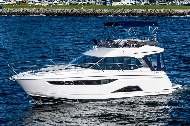 Slide: The Image of 2024 Bavaria R40 yacht cruising on open water, showcasing sleek design and luxury features. - 15