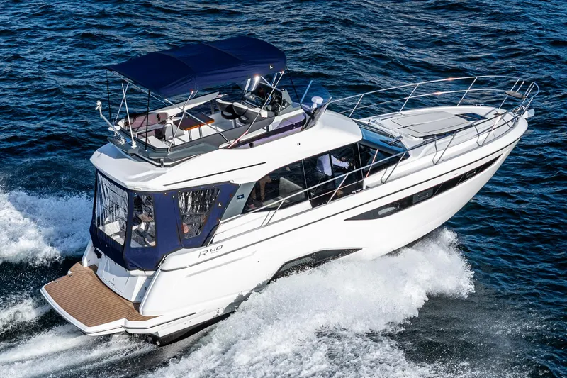 Slide: The Image of 2024 Bavaria R40 yacht cruising on open water, featuring sleek design and modern amenities. - 9