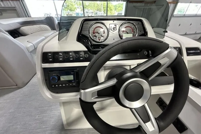 Slide: The Image of Steering console of 2026 Godfrey Sweetwater 2286 SFL boat, featuring modern controls and gauges. - 8