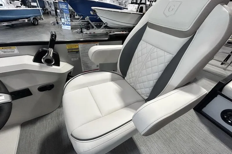 Slide: The Image of Captain's chair in 2026 Godfrey Sweetwater 2286 SFL boat, featuring luxurious white upholstery. - 13