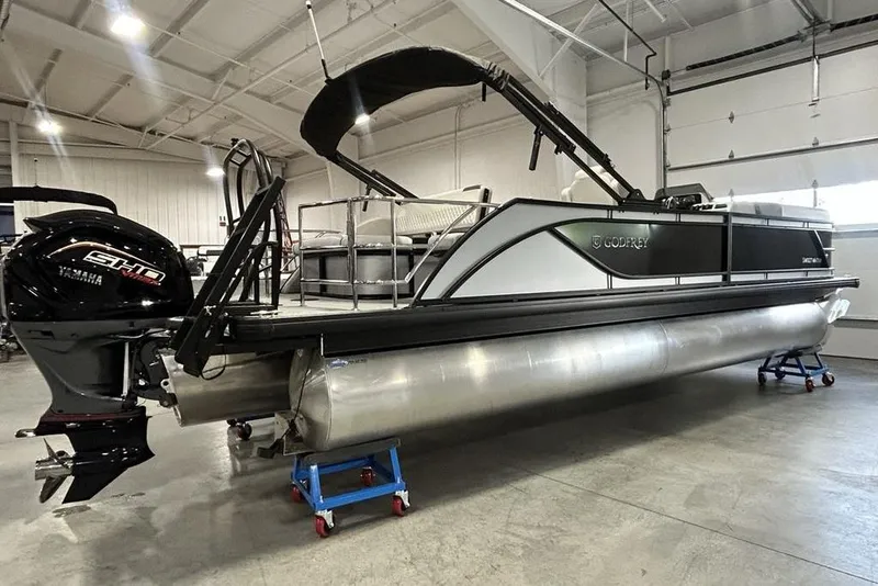 Slide: The Image of 2026 Godfrey Sweetwater 2286 SFL pontoon boat with Yamaha engine in a showroom. - 20