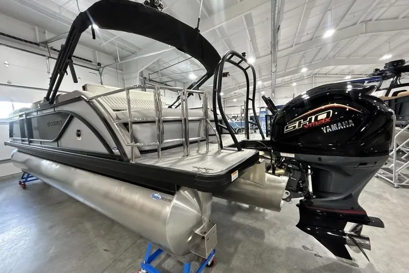 Slide: The Image of 2026 Godfrey Sweetwater 2286 SFL pontoon boat with Yamaha SHO engine in showroom. - 11