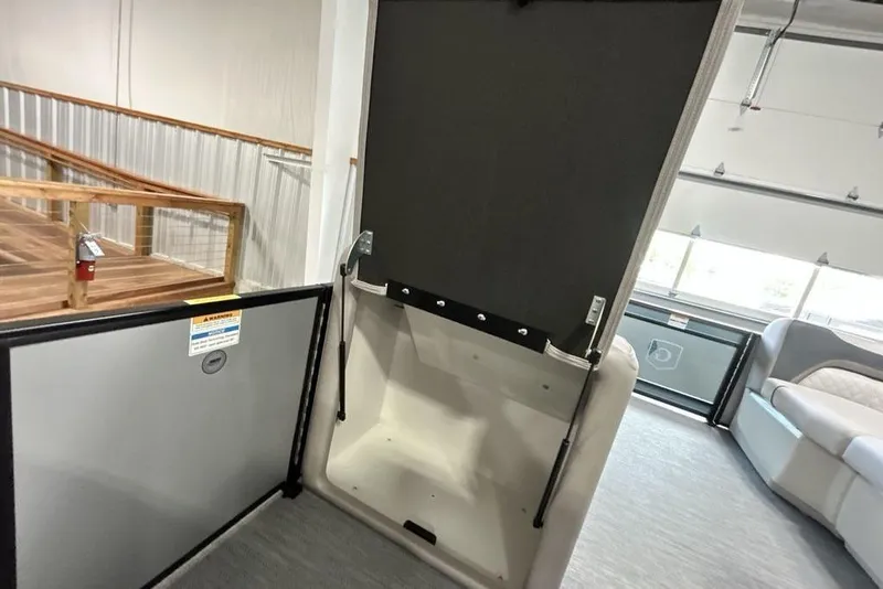 Slide: The Image of Interior of 2026 Godfrey Sweetwater 2286 SFL boat, featuring seating and storage area. - 18