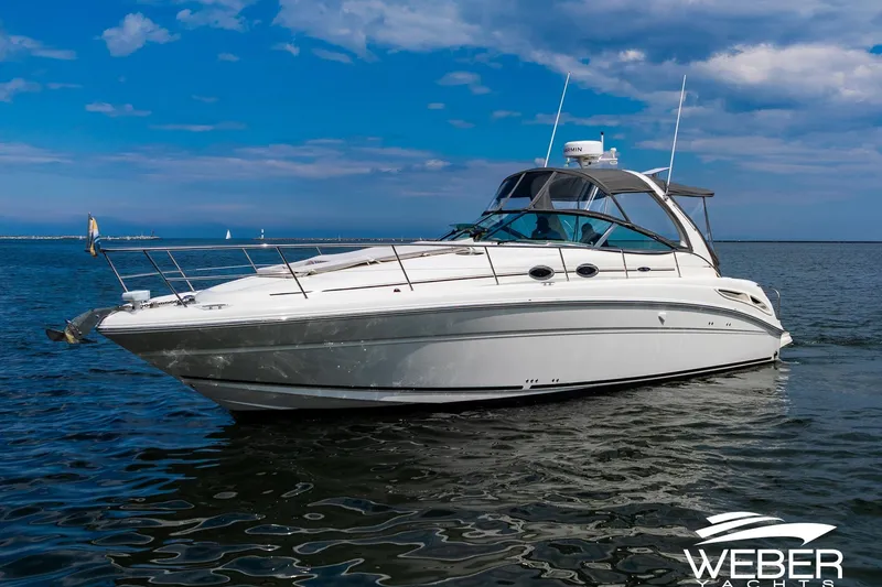 Slide: The Image of 2005 Sea Ray 360 Sundancer on calm water with clear skies. - 35