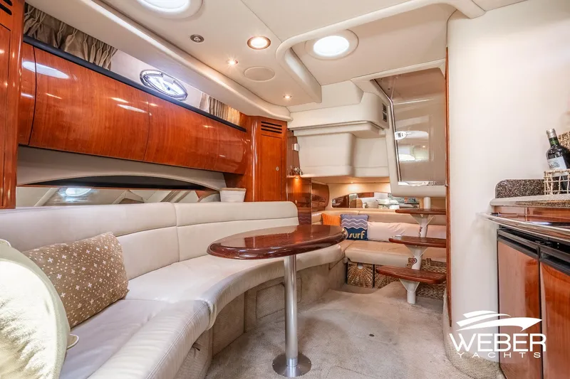 Slide: The Image of Interior of a 2005 Sea Ray 360 Sundancer with elegant wood paneling and comfortable seating. - 29