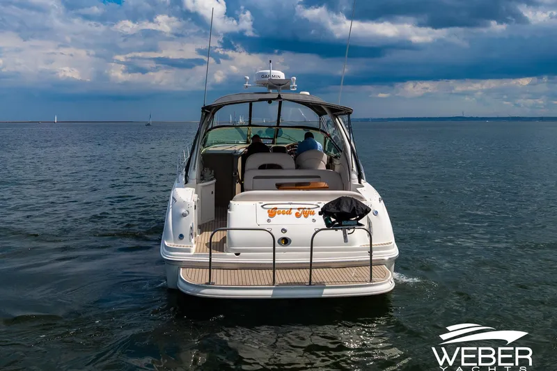 Slide: The Image of Rear view of a Sea Ray 360 Sundancer on the water. - 32