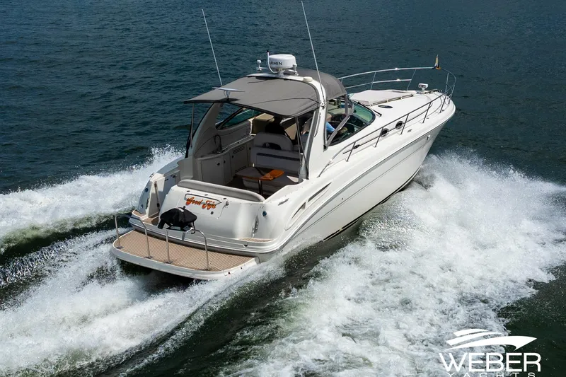 Slide: The Image of A 2005 Sea Ray 360 Sundancer cruising on the water. - 42