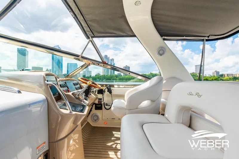 Slide: The Image of The cockpit of a 2005 Sea Ray 360 Sundancer with a view of the skyline. - 11