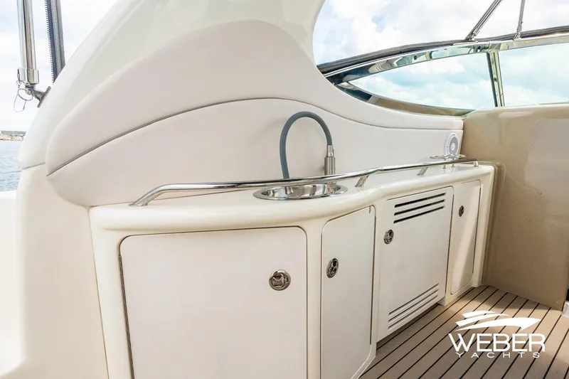 Slide: The Image of Galley area on a boat with a sink and storage. - 6