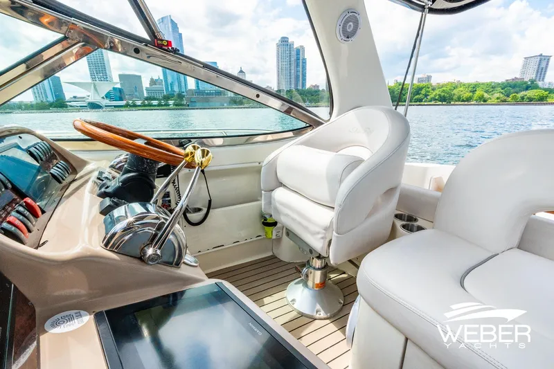 Slide: The Image of Interior of a 2005 Sea Ray 360 Sundancer with a view of the skyline. - 15