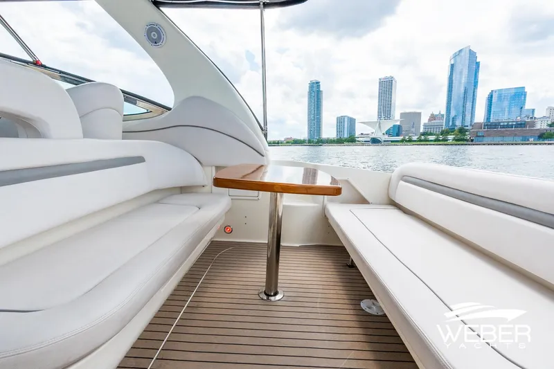 Slide: The Image of Interior of a Sea Ray 360 Sundancer with a city view. - 18