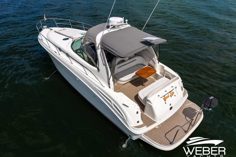 Slide: The Image of A 2005 Sea Ray 360 Sundancer on the water with a spacious deck. - 40
