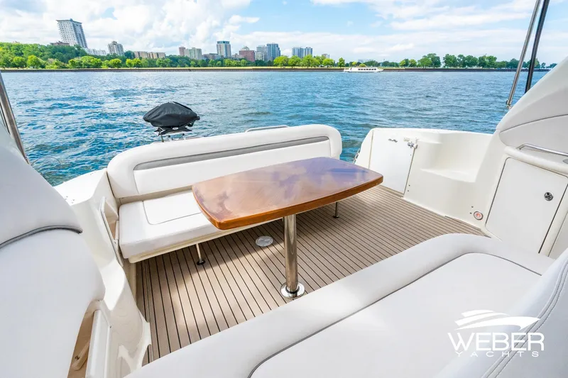 Slide: The Image of 2005 Sea Ray 360 Sundancer on the water with city skyline view. - 16