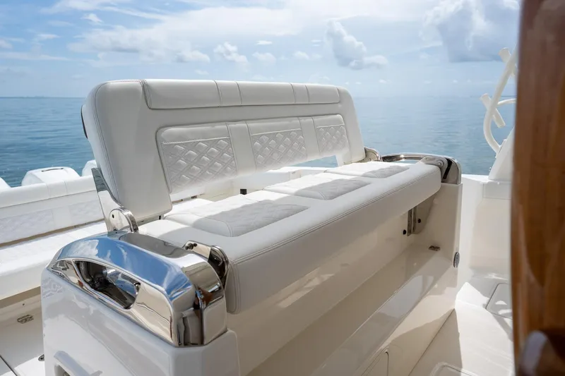 Slide: The Image of 2017 Boston Whaler 420 Outrage boat interior with luxurious white seating and ocean view. - 32
