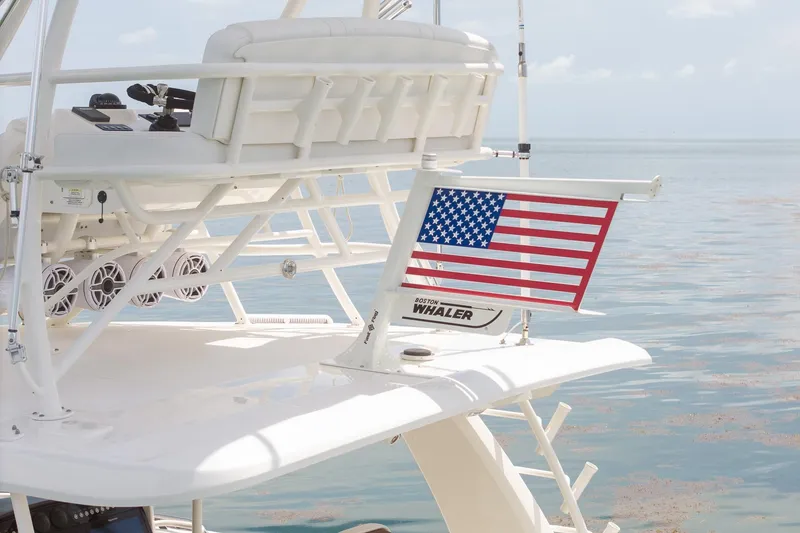 Slide: The Image of 2017 Boston Whaler 420 Outrage with American flag, showcasing luxury marine design. - 12