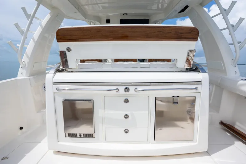 Slide: The Image of 2017 Boston Whaler 420 Outrage boat interior with sleek cabinetry and stainless steel accents. - 33