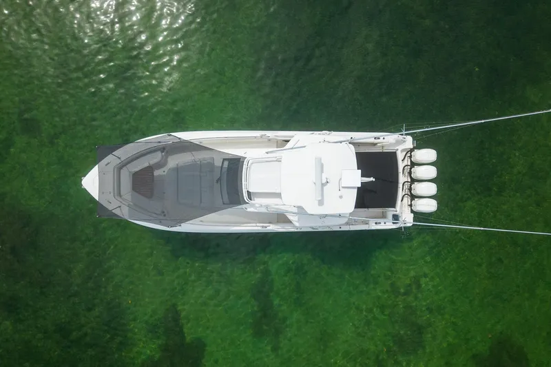 Slide: The Image of Overhead view of 2017 Boston Whaler 420 Outrage on clear green water. - 5