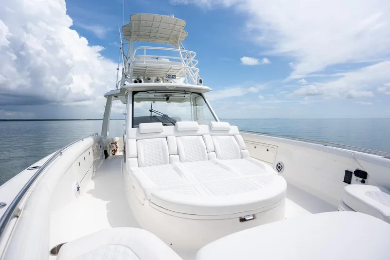 Slide: The Image of 2017 Boston Whaler 420 Outrage boat with luxurious seating on calm ocean waters. - 35