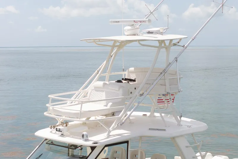 Slide: The Image of Boston Whaler 420 Outrage 2017 boat with elevated helm, ocean backdrop. - 11