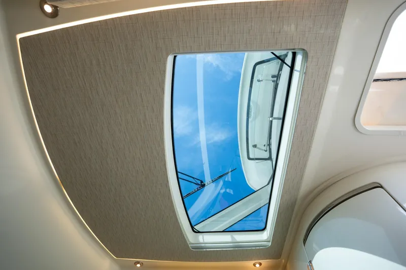 Slide: The Image of Skylight view from 2017 Boston Whaler 420 Outrage, showcasing elegant interior design. - 22