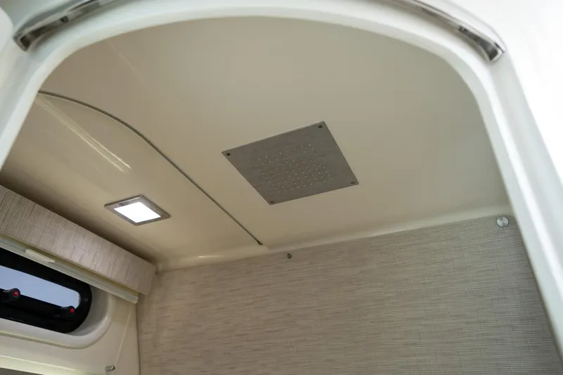 Slide: The Image of Interior ceiling of 2017 Boston Whaler 420 Outrage, featuring modern lighting and sleek design. - 18