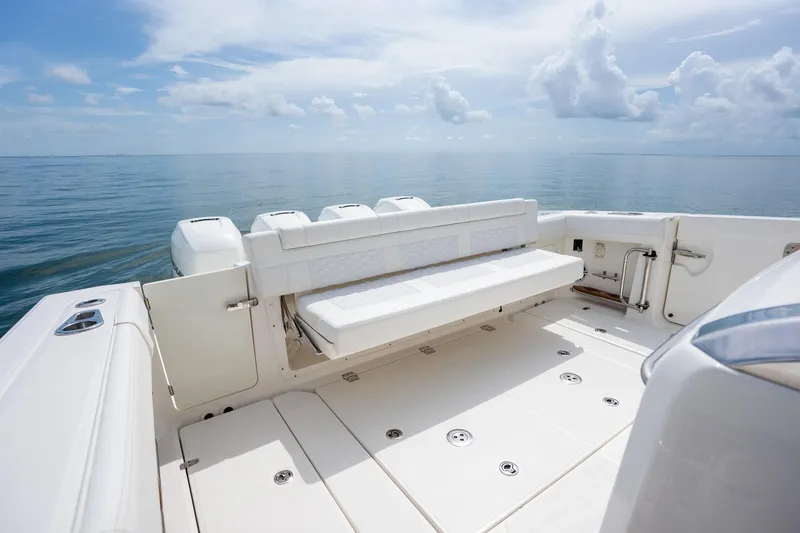 Slide: The Image of 2017 Boston Whaler 420 Outrage boat deck with seating, overlooking calm ocean waters. - 30