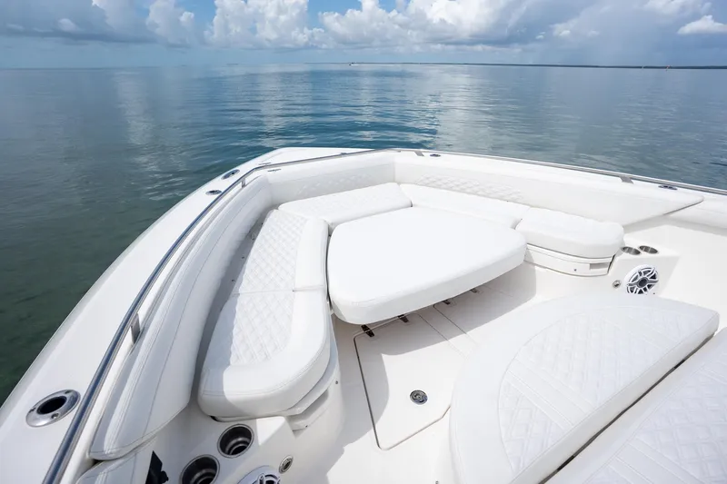 Slide: The Image of Luxurious seating on 2017 Boston Whaler 420 Outrage boat, calm ocean backdrop. - 37