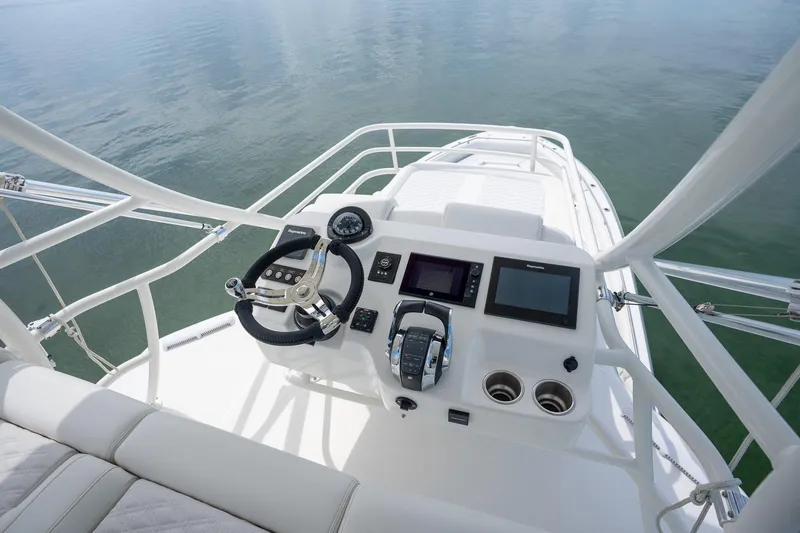 Slide: The Image of 2017 Boston Whaler 420 Outrage helm with modern controls and navigation screens. - 39