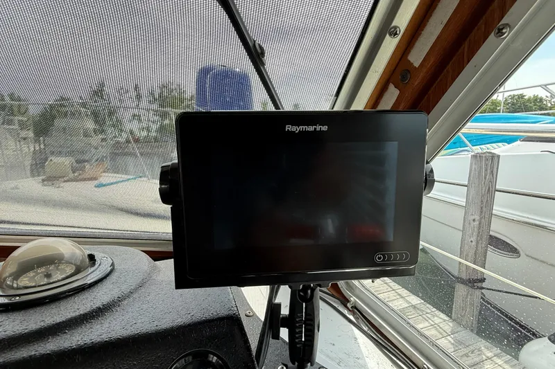Slide: The Image of Raymarine navigation system on 1985 Tollycraft 34 Sundeck Motor Yacht dashboard. - 18