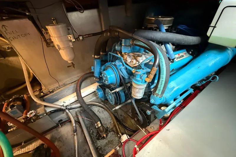 Slide: The Image of Engine room of 1985 Tollycraft 34 Sundeck Motor Yacht with blue Crusader engine. - 48