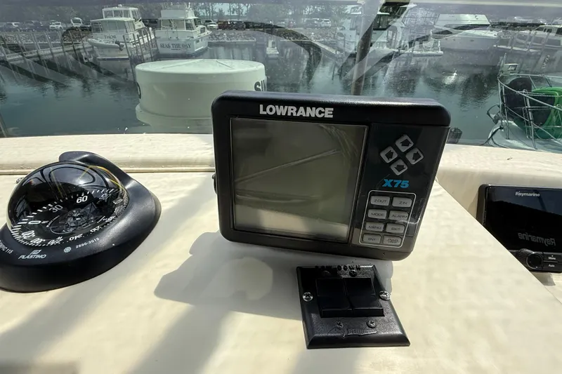 Slide: The Image of Dashboard of 1985 Tollycraft 34 Sundeck Motor Yacht with Lowrance X75 display. - 13