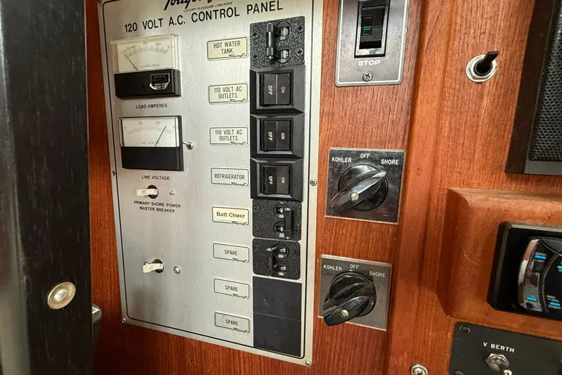 Slide: The Image of Control panel of a 1985 Tollycraft 34 Sundeck Motor Yacht with switches and gauges. - 22