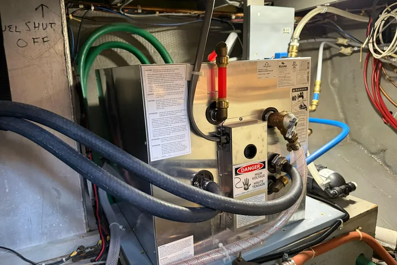 Slide: The Image of Engine room of 1985 Tollycraft 34 Sundeck Motor Yacht with wiring and equipment. - 43