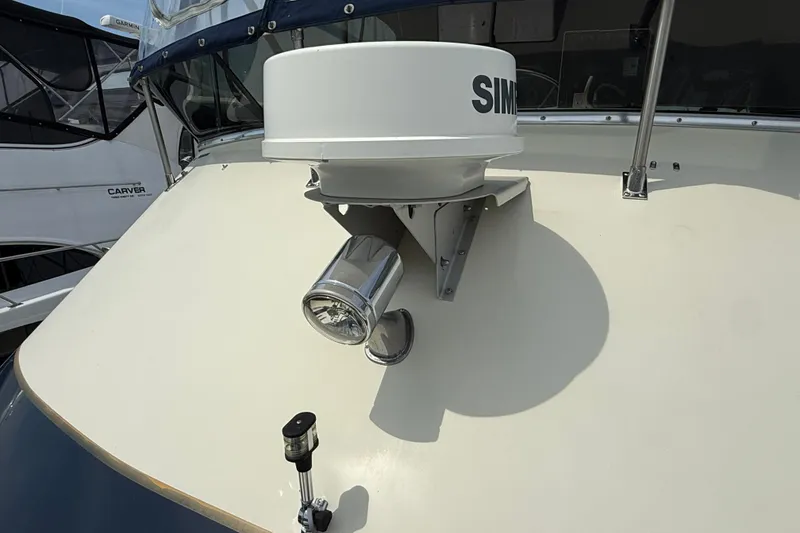 Slide: The Image of 1985 Tollycraft 34 Sundeck Motor Yacht radar and spotlight on deck. - 6