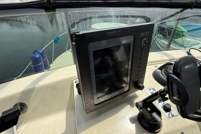 Slide: The Image of Simrad navigation system on 1985 Tollycraft 34 Sundeck Motor Yacht's helm. - 15
