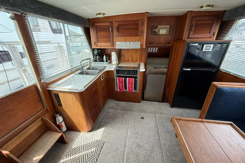 Slide: The Image of Interior of 1985 Tollycraft 34 Sundeck Motor Yacht with kitchen and dining area. - 23